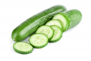 Cucumber and slices isolated over white background